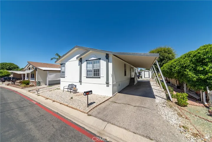 Right side view, covered carport.