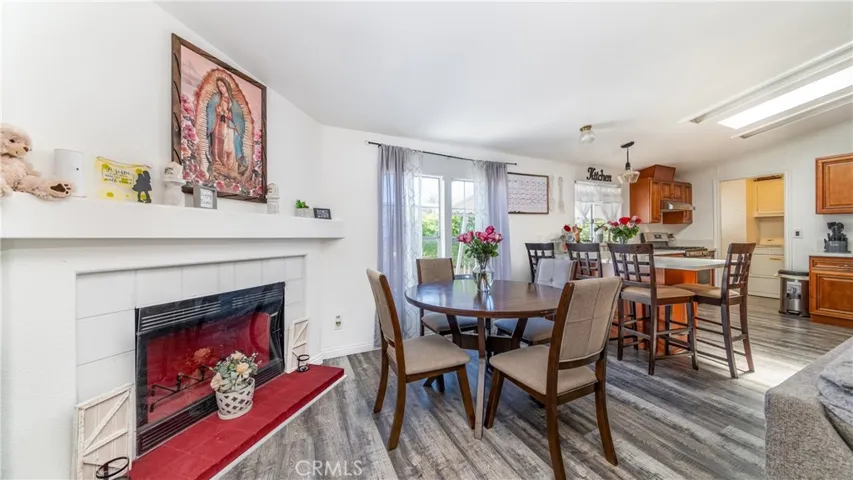 Enjoy a lovely fireplace as you gather around the table.
