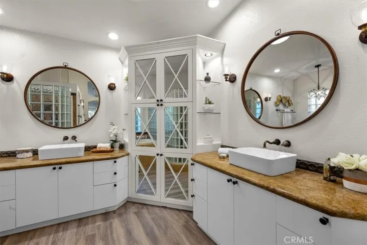 Dual vanities with above counter sinks.