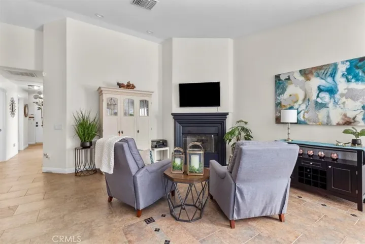 Secondary living space with cozy fireplace.
