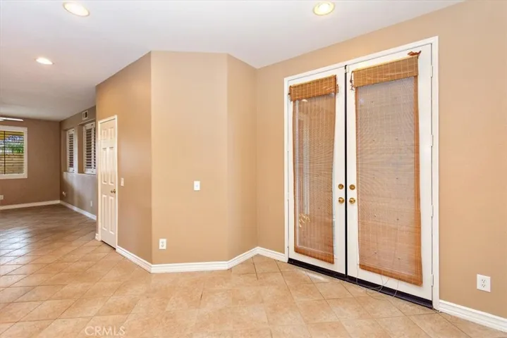 Eating area and French doors that open to a court yard.