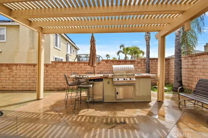 Built-in BBQ and seating area for entertaining.