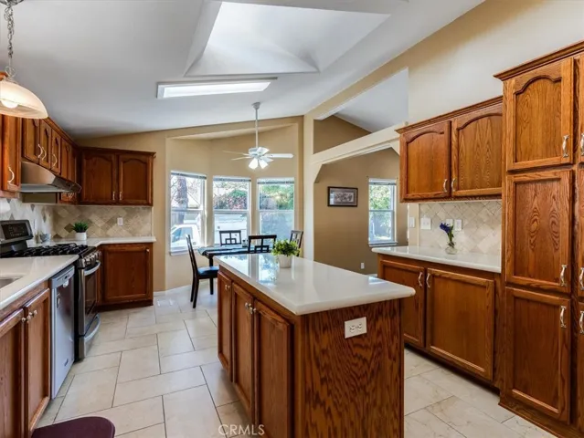 Enjoy this prep island, a coffee bar, and plenty of storage! Look! There's another skylight!