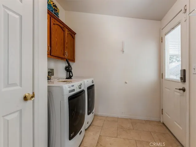 The laundry room, just off the kitchen is a perfect drop zone from the carport.