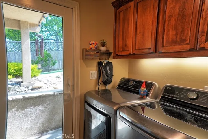 Laundry room with door to backyard