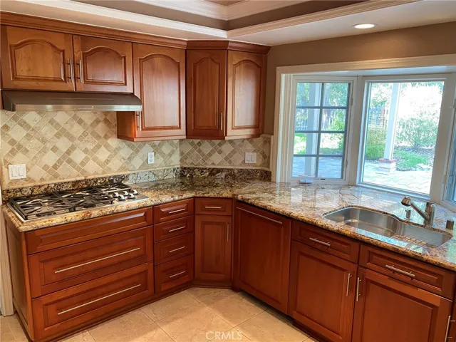 Kitchen with tranquil views of backyard.
