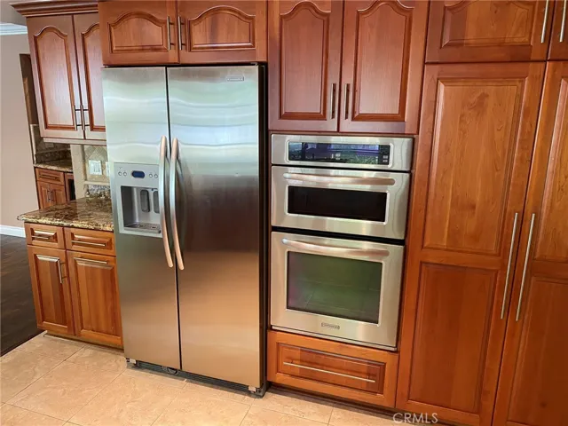 Kitchen Aid appliances and custom cabinetry.