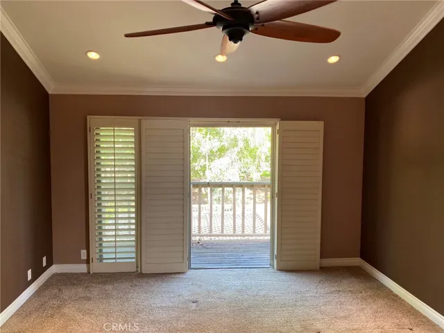 Primary bedroom with balcony.