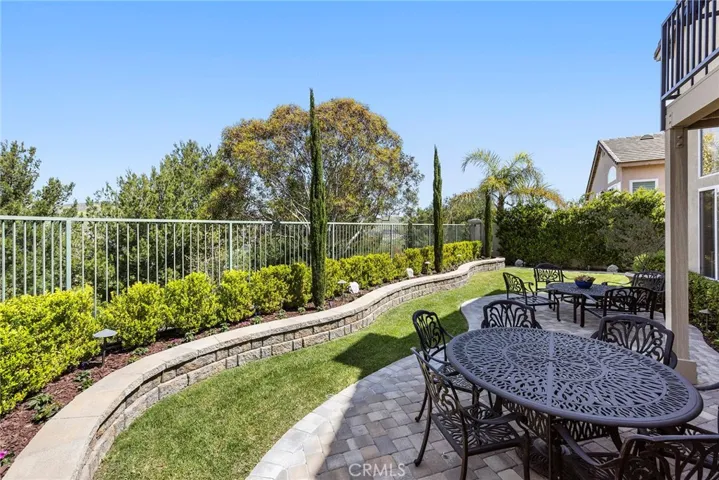 Paver designed patio with Stone planter wall
