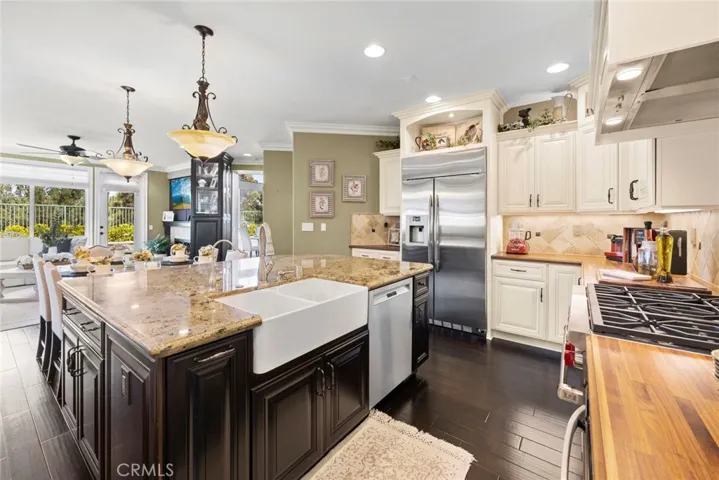 Farmhouse sink. Large Center Island. Lot's of Lighting. Cabinets have lot of Niches & Crown Molding