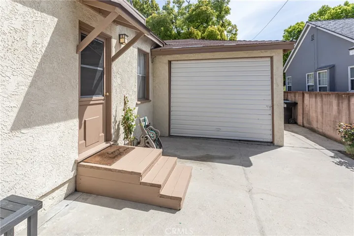 Home's garage has doors on both sides for passthrough convenience. The stairs are build to be moved to help vehicles access the rear.