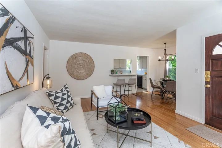 Front living room is spacious and looks into the dining room area and kitchen.