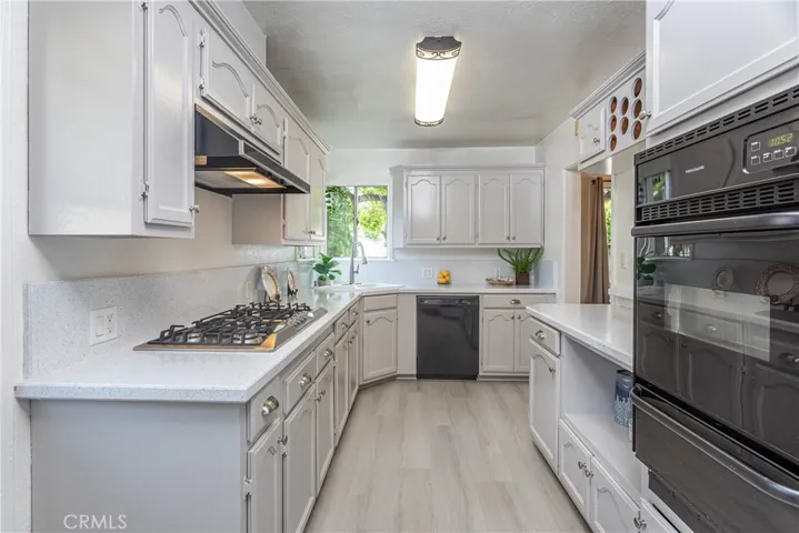 Kitchen is spacious galley style with an abundance of storage!