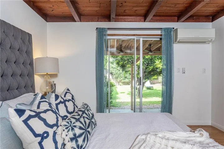 Primary Bedroom with sliding glass door to private covered patio.