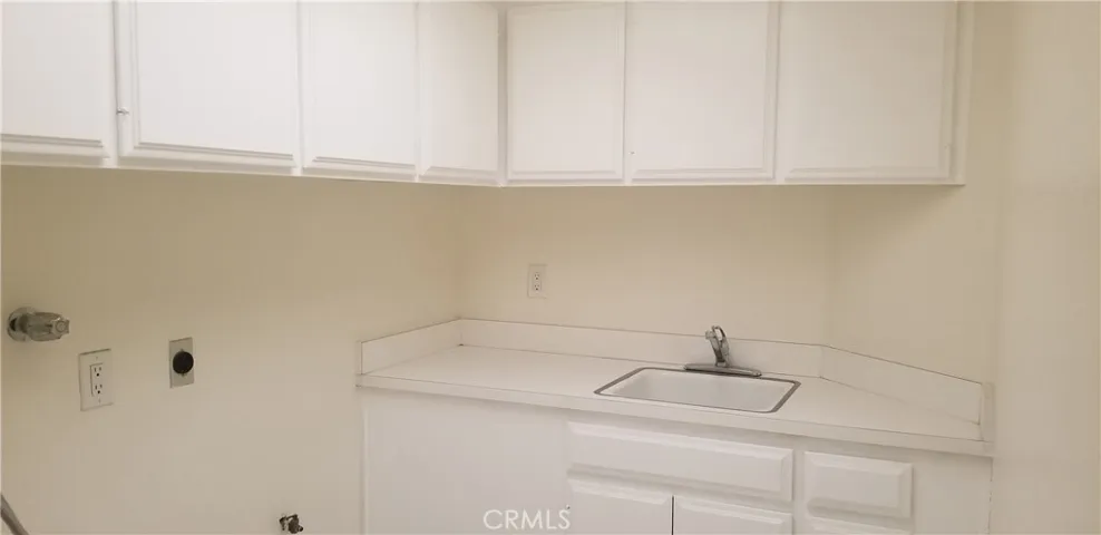 Laundry room with cabinets