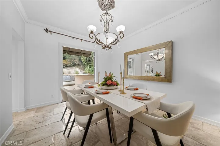 Dining room with double door to backyard
