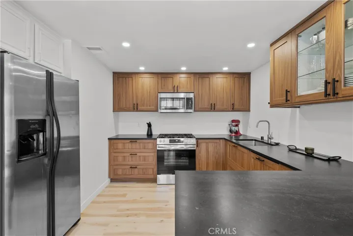 Kitchen with recessed lighting.