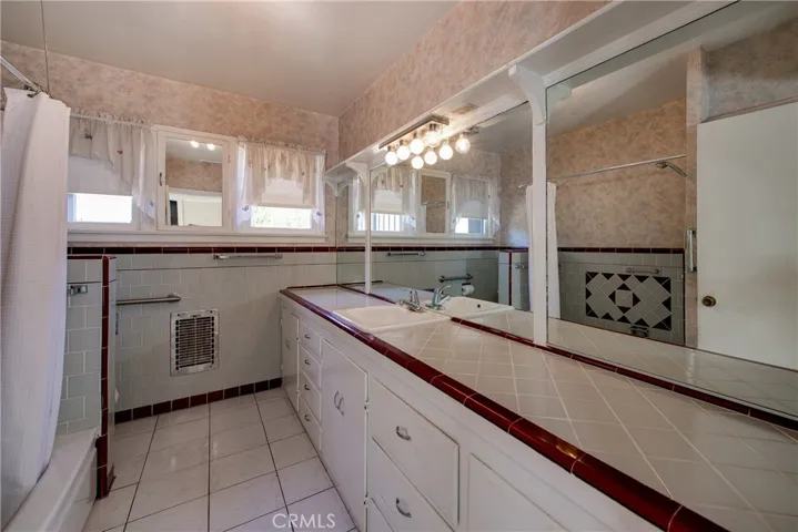 First bathroom off the living room side of house.