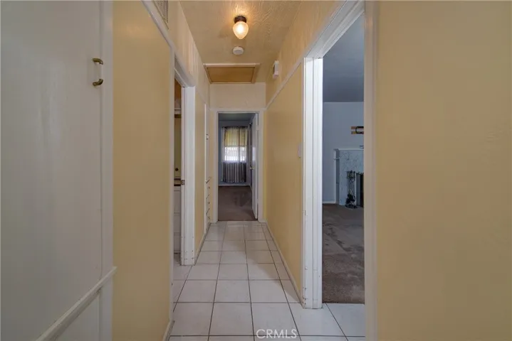 Hall left of living room leads to bedrooms 1 and 2 and a large bathroom.
