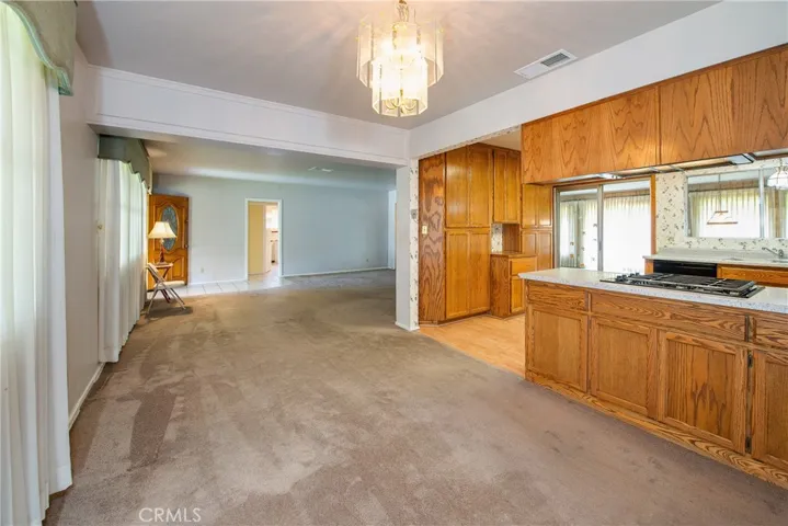 Looking through the dining room toward the living room. In the background is the hall to the first 2 bedrooms and bathroom. Just behind this picture is the other hall to the other 2 bedrooms and second bathroom. This hallway has a pocket door, so viola privacy any time needed.