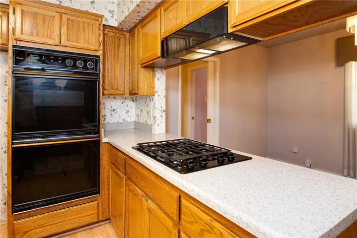 Double ovens and newer stove top and hood.