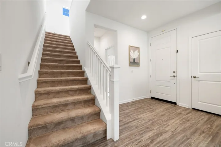 Access to stairs and main floor bedroom to the right