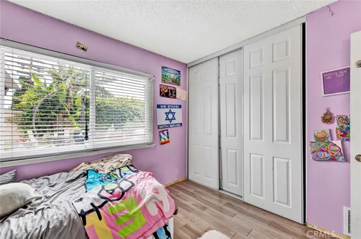 2nd Guest Bedroom With wood Grain Tile Floor also 6 Panel Closet Doors