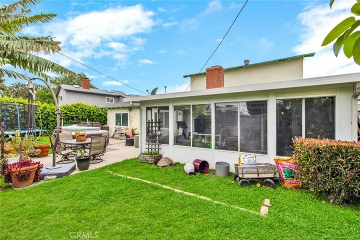 Backyard Showing Backside Of Enclosed Patio