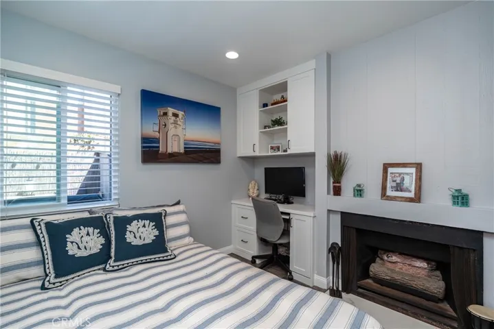 The sleeping area features a brand new built in storage and desk space, new windows and blinds, lighting and flooring and this relaxing fireplace!