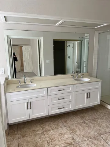 Primary bath vanity with shaker doors.