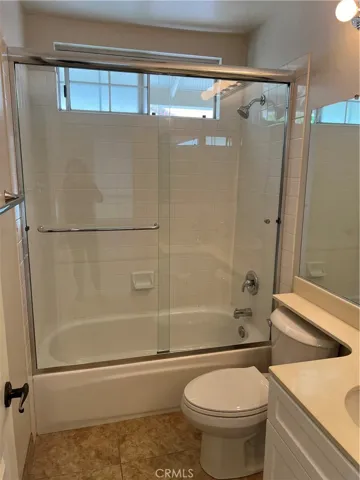 Hall bath with new enclosure & refurbished tub