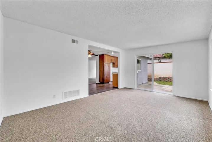 family room looking to patio door into backyard.