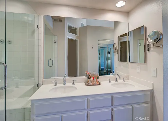 Owner's suite beautiful bathroom with skylight for natural light!. Dual sinks, upgraded fixtures, plenty of counter & cabinet space.