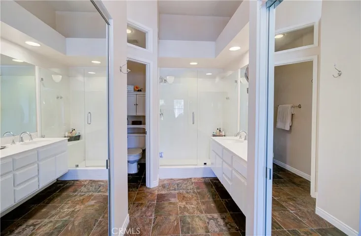 Owner's suite has 2 mirrored wardrobes on each side as you enter the private bath. Plenty of closet space here!