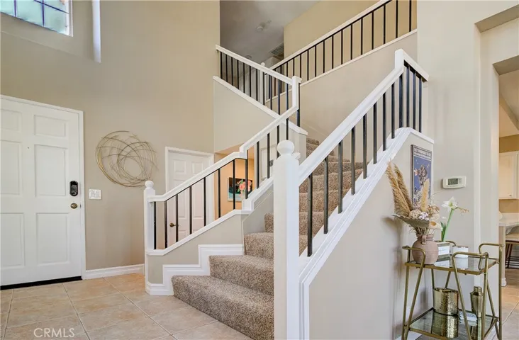 Sweeping staircase leads to bedrooms