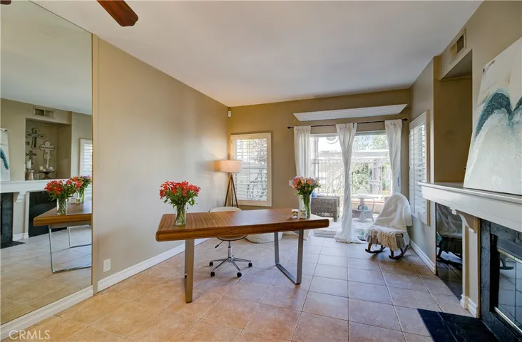 Mirror tastefully placed in dining area. Gives the space an extra-open feel.