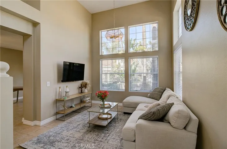 Living room is so open with tons of windows. Very few homes in this community feature this many windows.  It's the lot location that is so special!