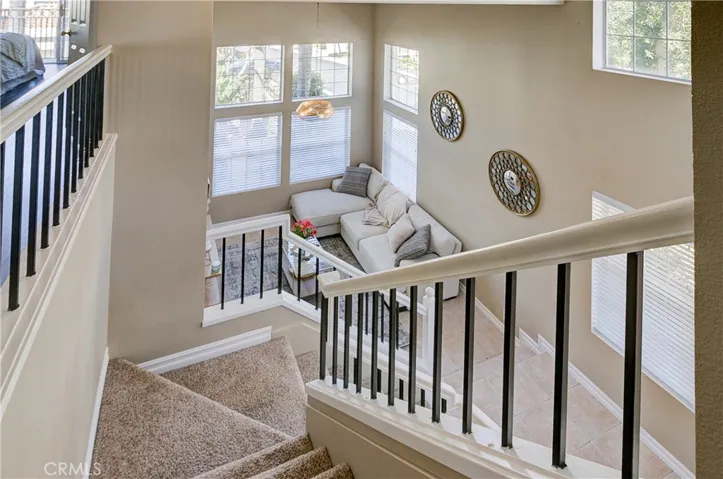 Sweeping staircase looking down towards living room