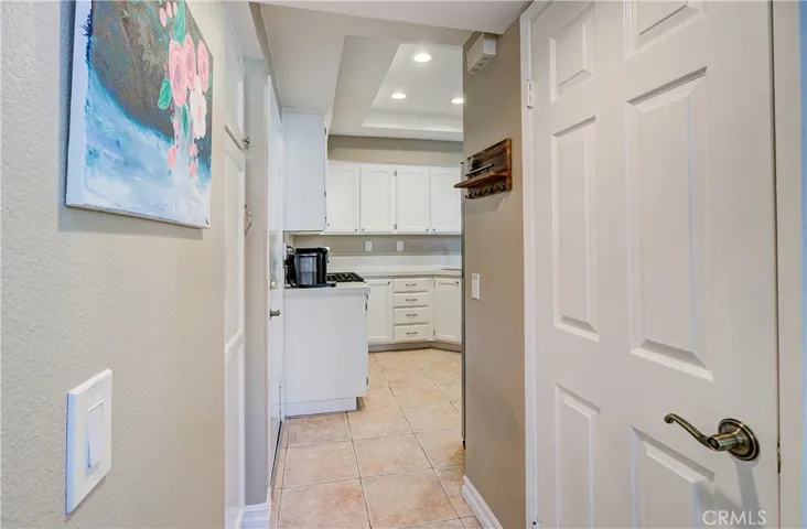 Hallway from entry way leading to kitchen.