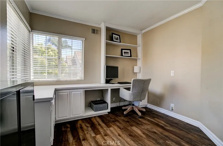 another secondary bedroom with built-in shelves & plenty of light.