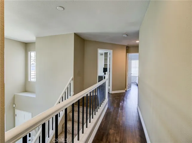 Hallway from owner's suite - looking towards the 2 secondary bedrooms at other end of hallway.  Love the privacy of this home!
