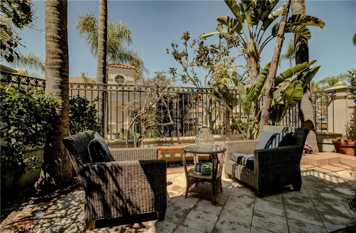 Private back patio off family room.  When the bougainvillea is in full bloom, it creates a special, private oasis