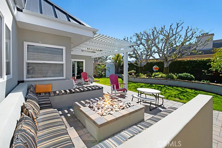 Large fire pit and built in bench seating.