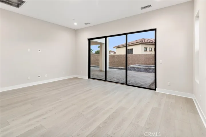 Primary Bedroom with sliding door to backyard and pool.