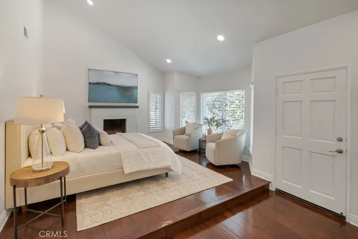 Primary bedroom with door to balcony