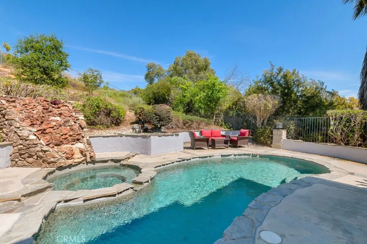 Backyard with pool, spa and waterfall