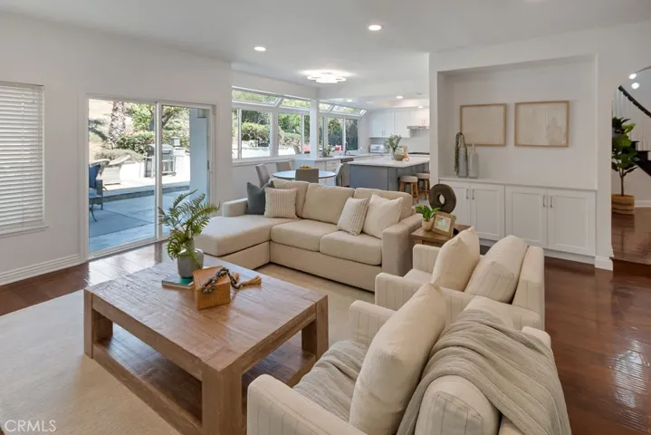 Family room with view to kitchen and slider door to backyard