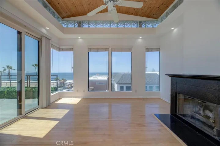 A fireplace to keep you warm, a ceiling fan to keep you cool and an outdoor balcony to provide the most balmy sea breezes!  :)