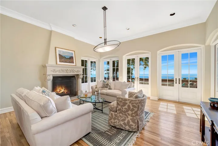 French doors that open to a private wraparound balcony.