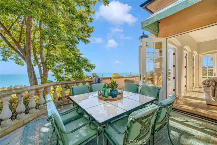 Dine alfresco with a  wraparound veranda.